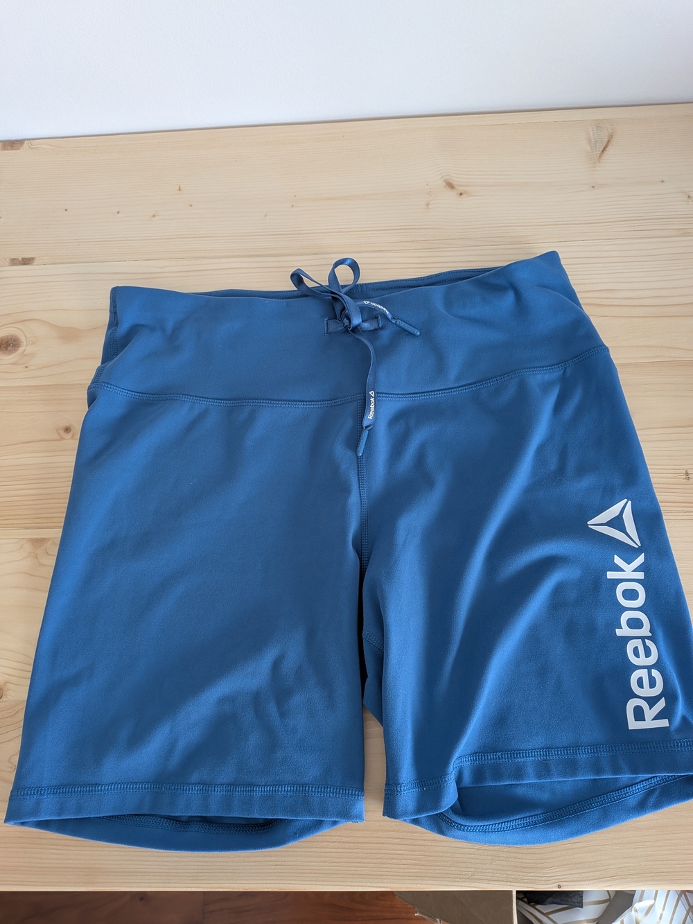 Reebok Women's Light Blue Athletic Shorts with White Logo